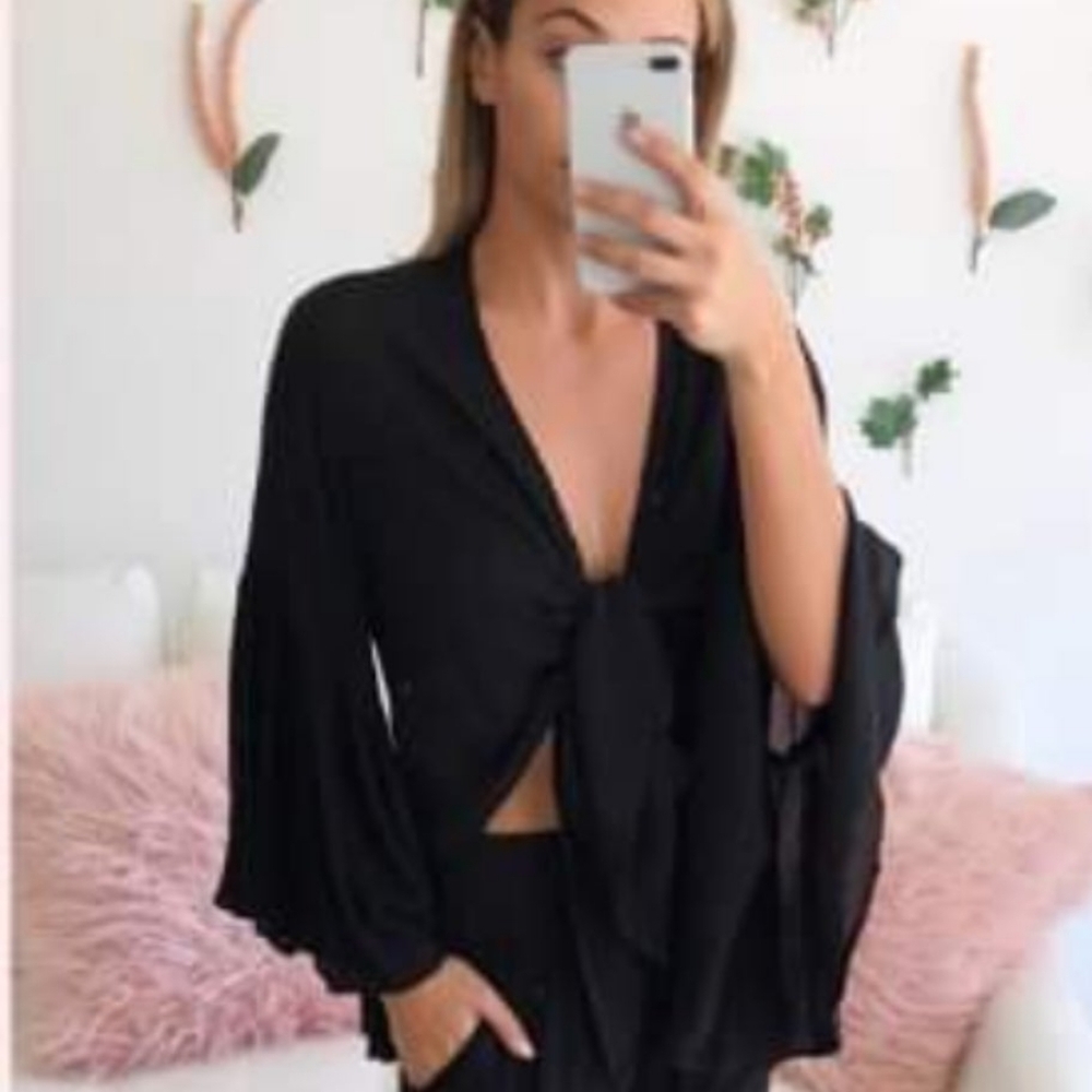 Our wrap top one size add to your wardrobe for a fun and versatile piece